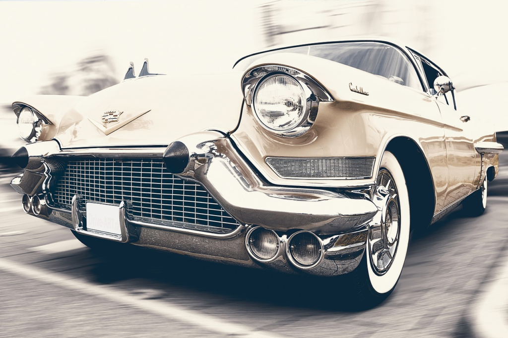 A classic light-colored Cadillac car viewed from in front 