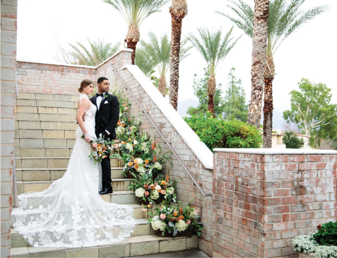 Stairway at Omni Tucson National Resort and Spa with a bride and groom and floral feature on stairs